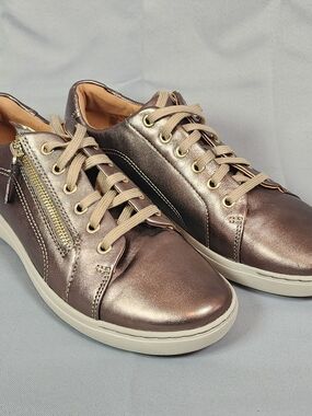 Clarks Nalle Lace Leather Metallic Bronze Sneakers with Side Zip Accent.